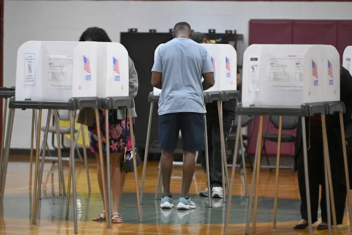 Federal judge bars Trump from implementing proof of citizenship requirement to vote