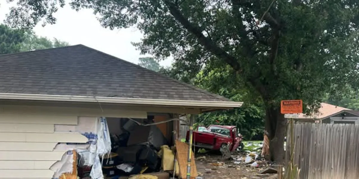 1 injured after truck drives through Longview home
