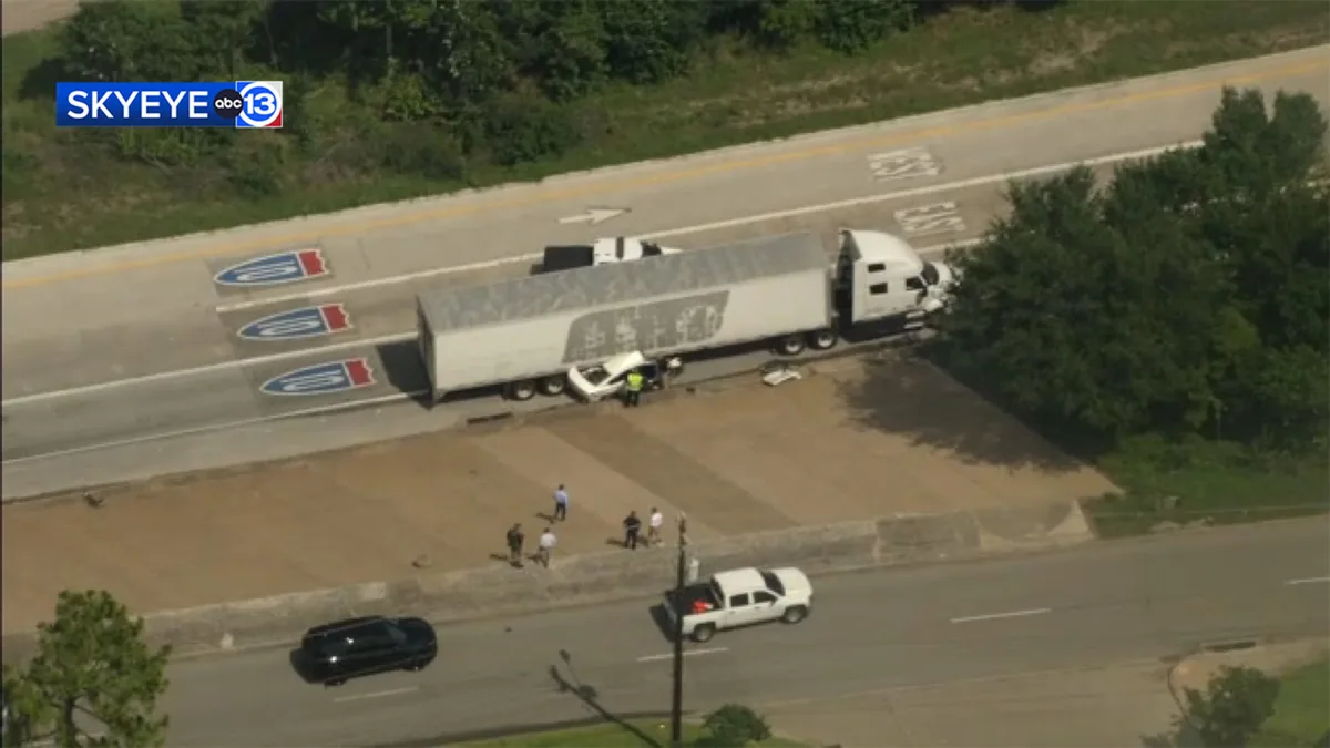 SkyEye13 shows crash aftermath involving big rig and car on East Loop