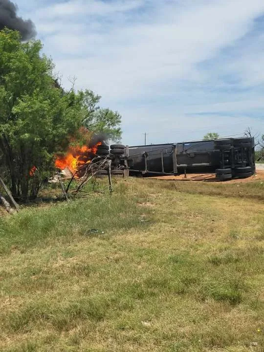 Semi-trailer truck truck overturns, catches fire after crash east of Anson