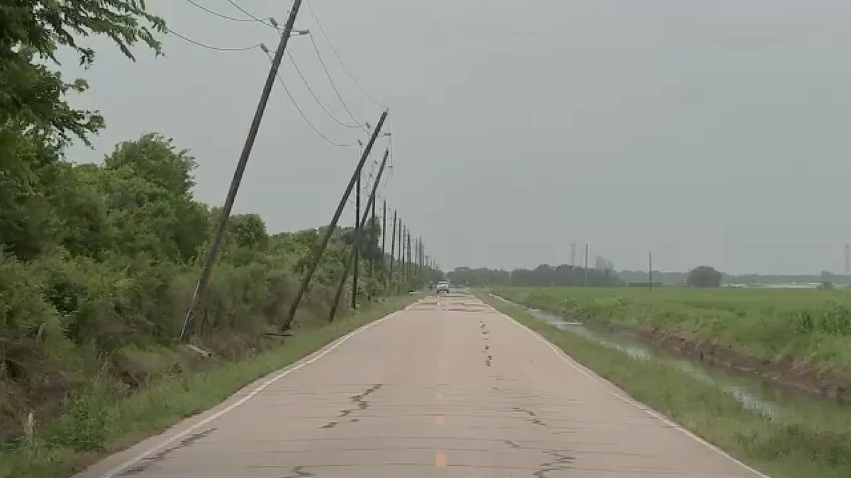 Images show power poles leaning over Brazoria County road, neighbors say it's not the first time
